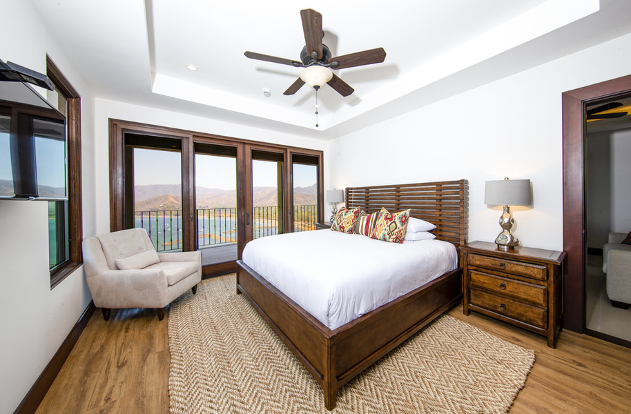 marina view bedroom with patio