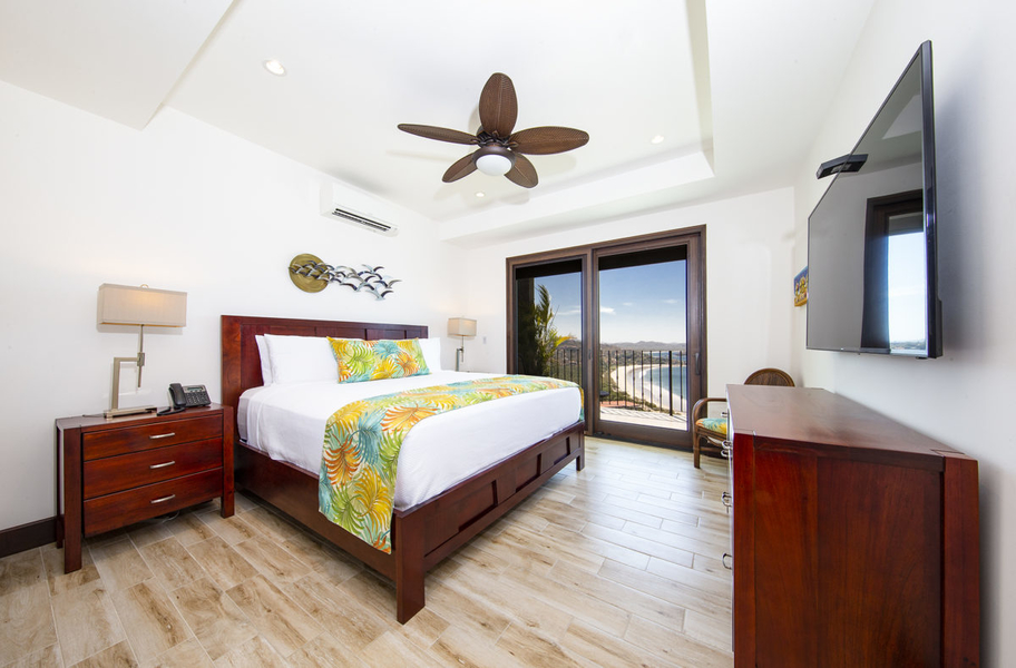 bedroom with patio and views of Playa Flamingo
